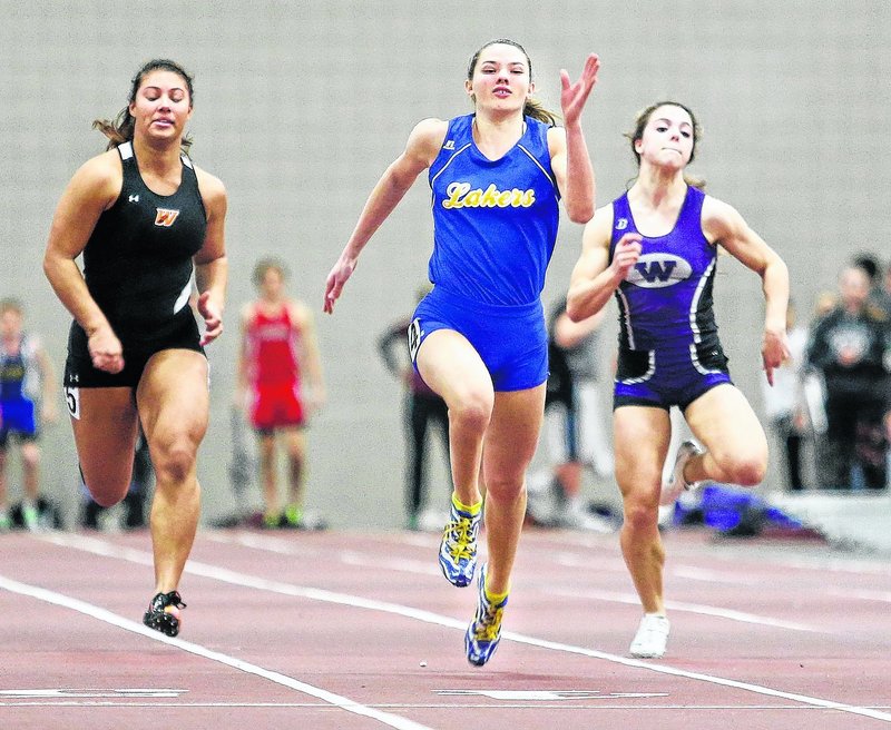 Lake Region’s Kate Hall, center, defended three state titles at the Class B meet and went on to eclipse all-time Maine bests in the 55 meters and long jump at the New England championships in Boston.