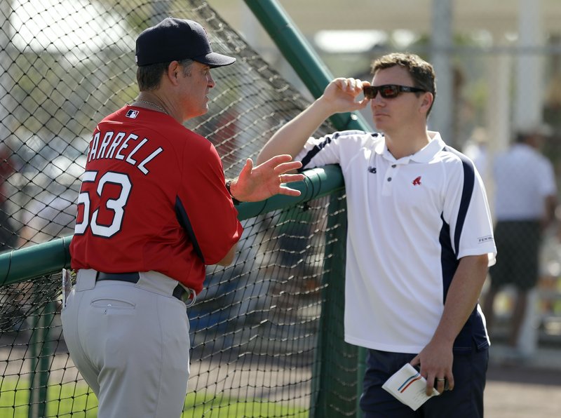 Red Sox manager John Farrell, left, talks to general manager Ben Cherington after a team workout in Fort Myers, Fla. “We’ve had a good spring training,” Cherington said.