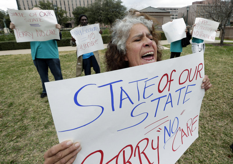 Maria Webster joins others protesting against Texas Gov. Rick Perry’s stance on health care outside the state capitol in Austin, Texas, in January. Despite the state having the highest percentage of uninsured, Perry is not promoting federal insurance exchanges.