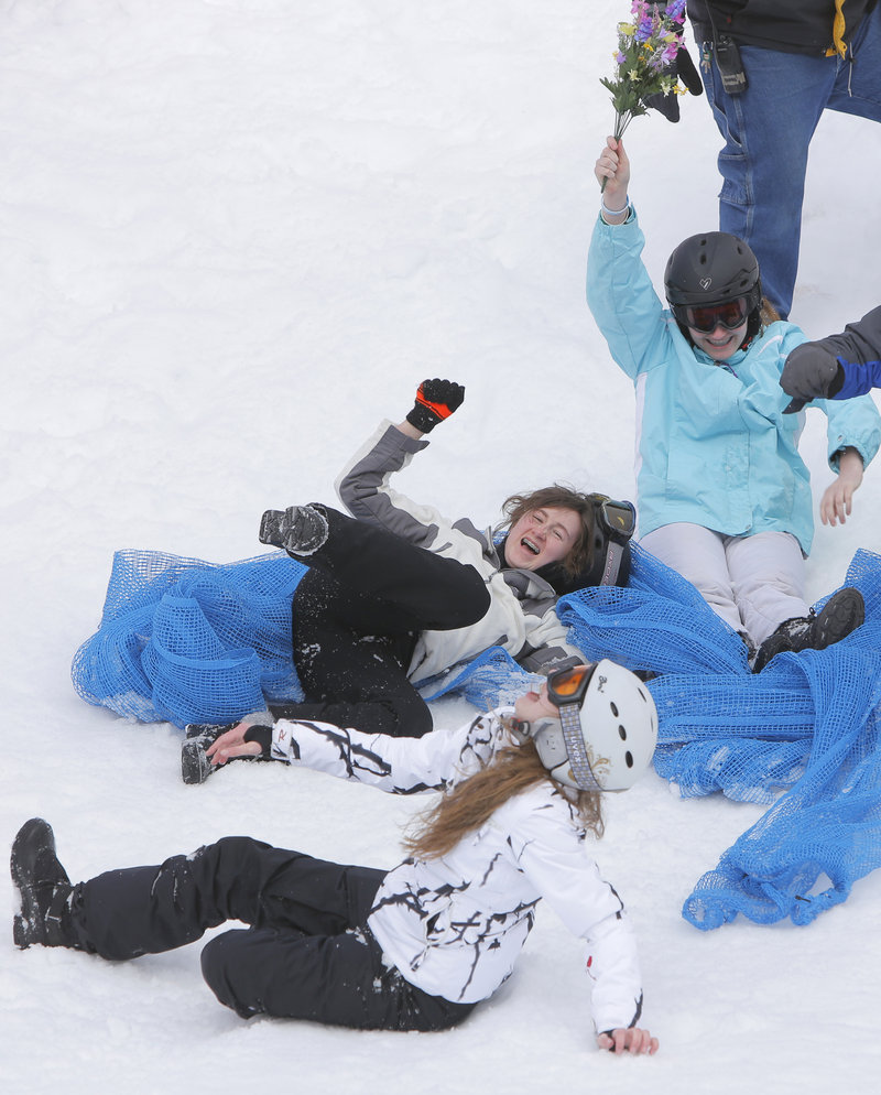Amy McGurk, Noelle Veillette and Catherine Menousek are all smiles after finishing their run in the Mattress Race at Shawnee Peak in Bridgton on Saturday.