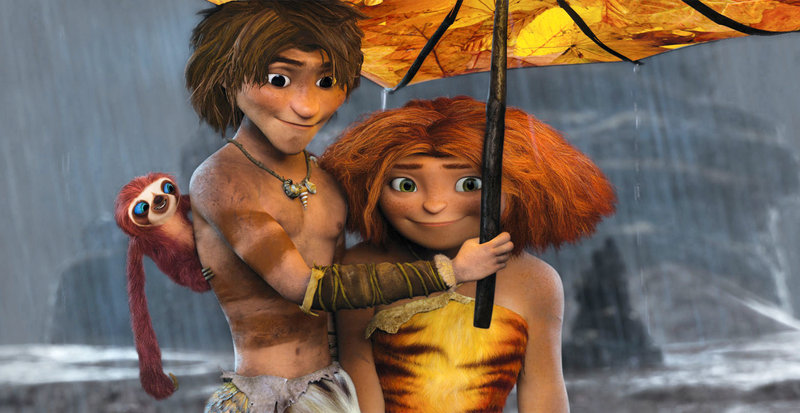 Belt the sloth, from left, voiced by Chris Sanders; Guy, voiced by Ryan Reynolds; and Eep, voiced by Emma Stone, are shown in a scene from “The Croods.”