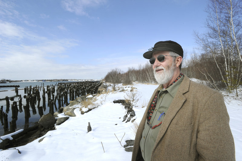 Portland Yacht Services owner Phineas Sprague shows a section of the Portland waterfront where he hopes to build a boatyard.