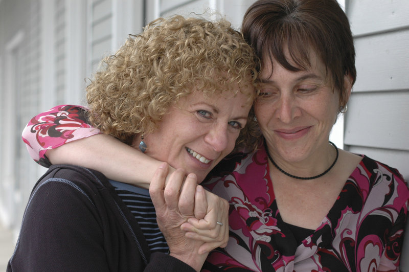 Photo by Beth Kucucha: Sazanne Blackburn, left, and Joanie Kunian embrace on a recent trip to Massachusetts.