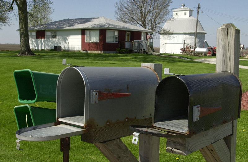 The Postal Service’s lack of investment in facilities to handle parcels – not the cost of delivery to rural mailboxes, such as these outside Morrison, Ill. – is the reason it’s losing money, a reader says.