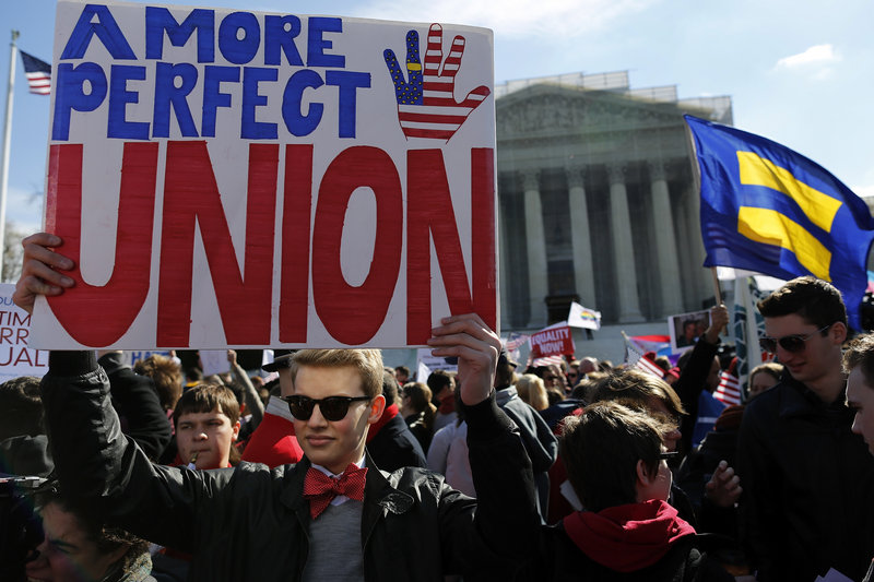 Protesters rally against the Defense of Marriage Act in front of the U.S. Supreme Court in Washington on Wednesday. Congress overwhelmingly supported the law in 1996.