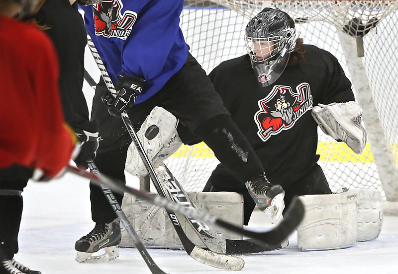 Goalie Devan Kane of Scarborough blocks a puck during practice, as the girls’ U19 team gets ready for the upcoming national tournament in early April at San Jose, Calif.