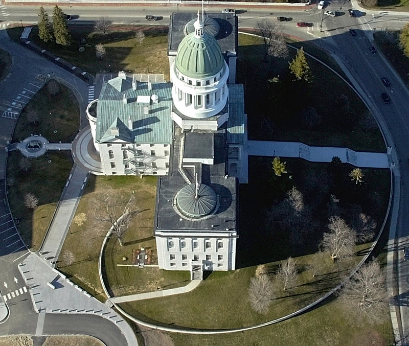 This 2007 file aerial photo shows the Maine State House in Augusta. A $1.2 million project that will turn the State House dome from green to brown still awaits final approval.