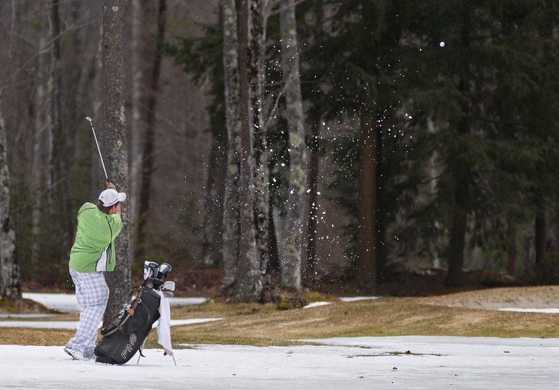The snow may still be around but that didn’t stop Zach Steele of Fort Myers, Fla., the assistant golf pro at Dunegrass Golf Club in Old Orchard Beach, from hitting the links Friday during the opening of Nonesuch River Golf Course in Scarborough.