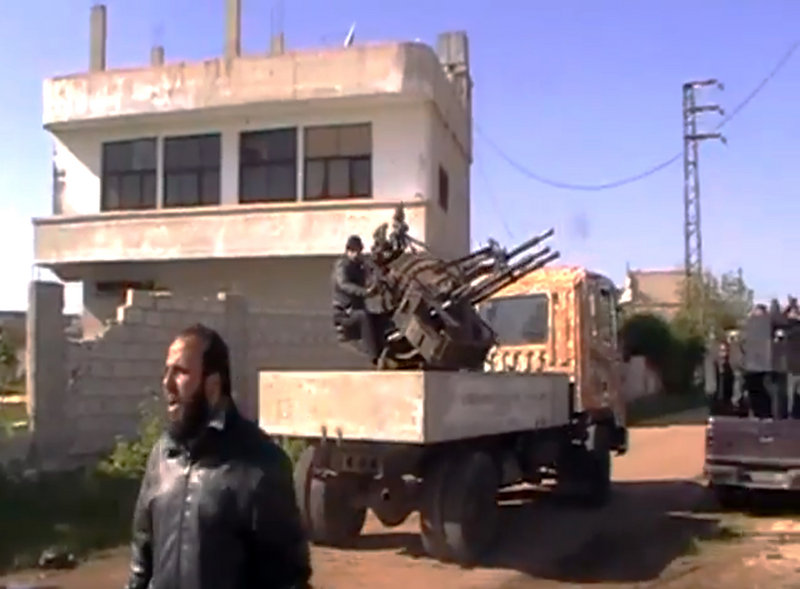 Image taken from video shows Syrian Free Army fighters in Dael, less than 10 miles from the Jordanian border.