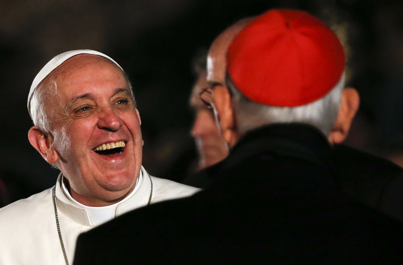 Pope Francis laughs as he arrives to lead the Via Crucis – or Way of the Cross – procession during Good Friday at the Colosseum in Rome. Francis chose to stress Christians’ positive relations with Muslims in brief remarks at the end of the ceremony.
