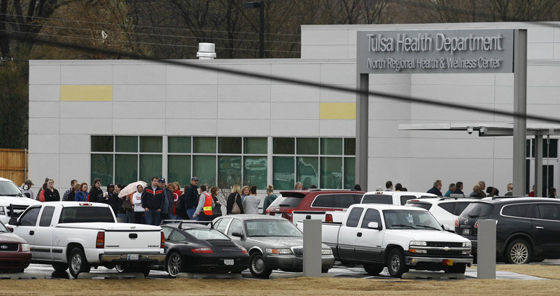 About 150 to 200 patients of Dr. W. Scott Harrington line up outside a Tulsa Health Department clinic on Saturday to be screened for hepatitis and the virus that causes AIDS.