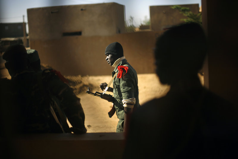 A Malian soldier walks in Gao, northern Mali. French troops joined the Malian army in Timbuktu on Sunday to fight Islamic radicals.