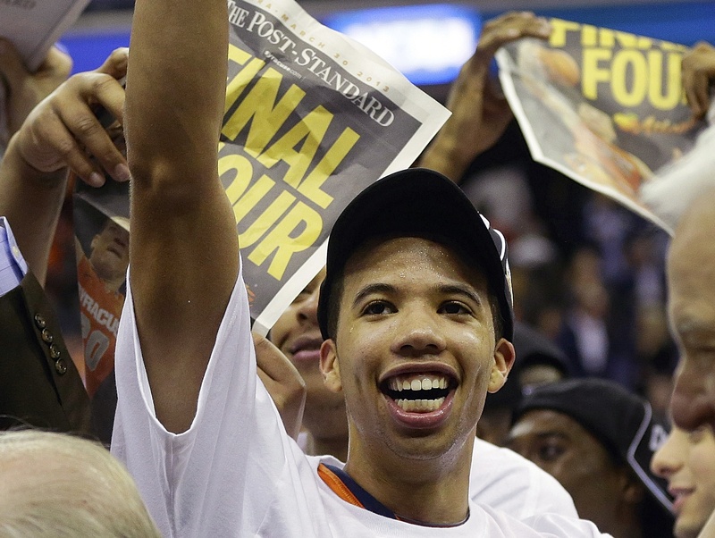Michael Carter-Williams leads the celebration Saturday after Syracuse defeated Marquette 55-39 and advanced to the Final Four for the first time since 2003, when it won the national title.