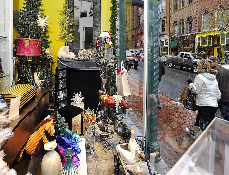 In this November 2011 file photo, an attractive window display by Abacus Gallery on Exchange Street in Portland attracts the shoppers' eye. A new bill would allow Maine stores with less than 10,000 square feet of interior selling space to be open on Easter, Thanksgiving and Christmas.