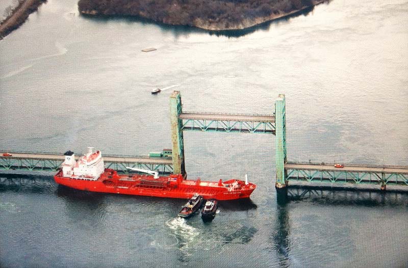 An aerial photo of the tanker Harbour Feature sitting sideways in the Piscataqua River after hitting the Sarah Mildred Long Bridge on Monday.