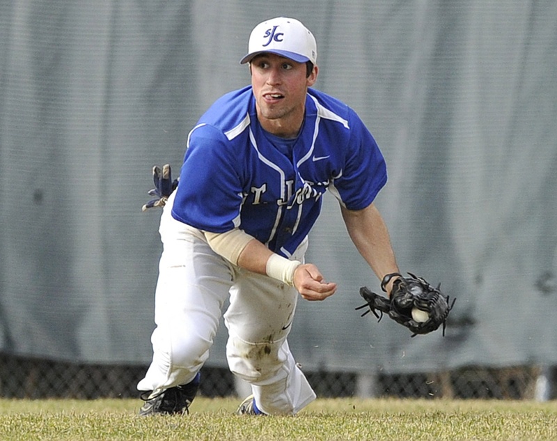 St. Joseph's centerfielder Louie Vigars comes up with the ball during a game in April.