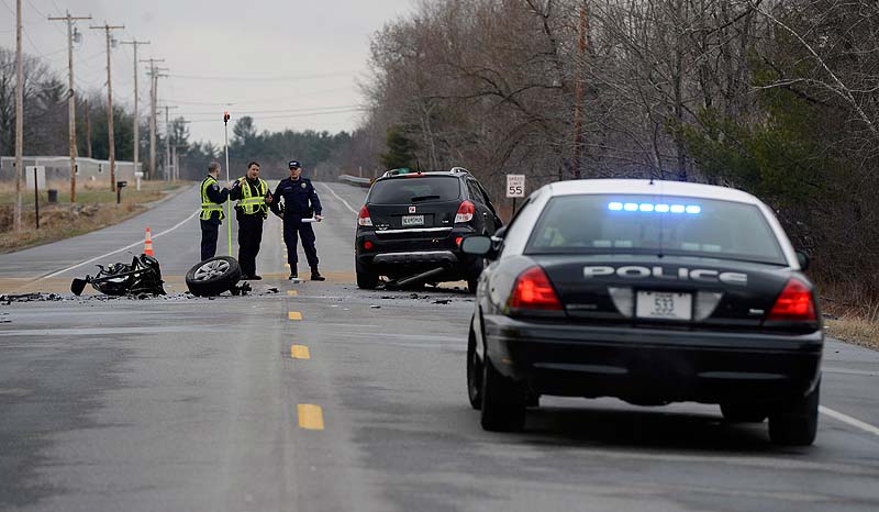 An accident reconstruction team examines the scene of a fatal crash on Route 4 in Berwick last Wednesday.