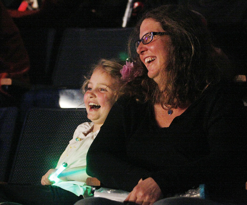 Lucy Green of Portland and her daughter Caroline, 6, enjoy the circus.