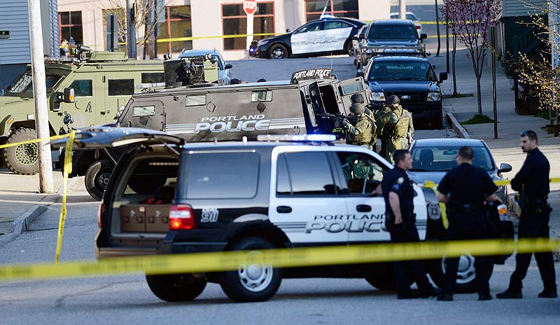 Portland police and SWAT team members respond to a standoff at 41 Alder St. in Portland on Monday.