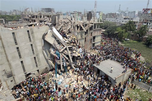 People and rescuers gather after an eight-story building housing several garment factories collapsed in Savar, Bangladesh. Firefighters and soldiers using drilling machines and cranes worked together with local volunteers in the search for other survivors from the building.