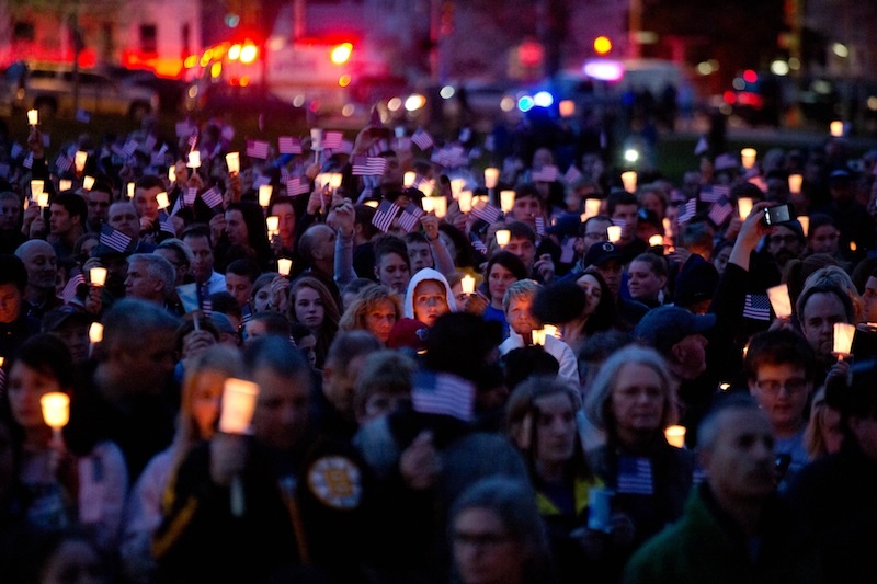 Mourners attend candlelight vigil for Martin Richard at Garvey Park, near Richard's home in the Dorchester section of Boston, on Tuesday, April 16, 2013. Martin is the 8-year-old boy killed in the Boston Marathon bombing. (AP Photo/The New York Times, Josh Haner) Merlin ID:68234504;20130416;NYTREMOTE