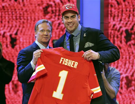 Tackle Eric Fisher from Central Michigan stands with NFL Commissioner Roger Goodell after being selected first overall by the Kansas City Chiefs in the first round of the NFL football draft Thursday at Radio City Music Hall in New York.