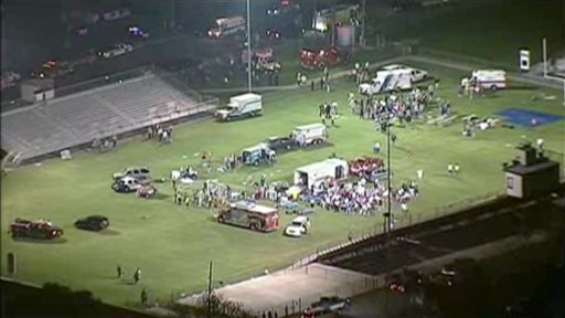 This video image provided by WFAA-TV shows injured people being treated on the flood-lit the high school football field turned into a staging area after the blast in West, Texas, on Wednesday.