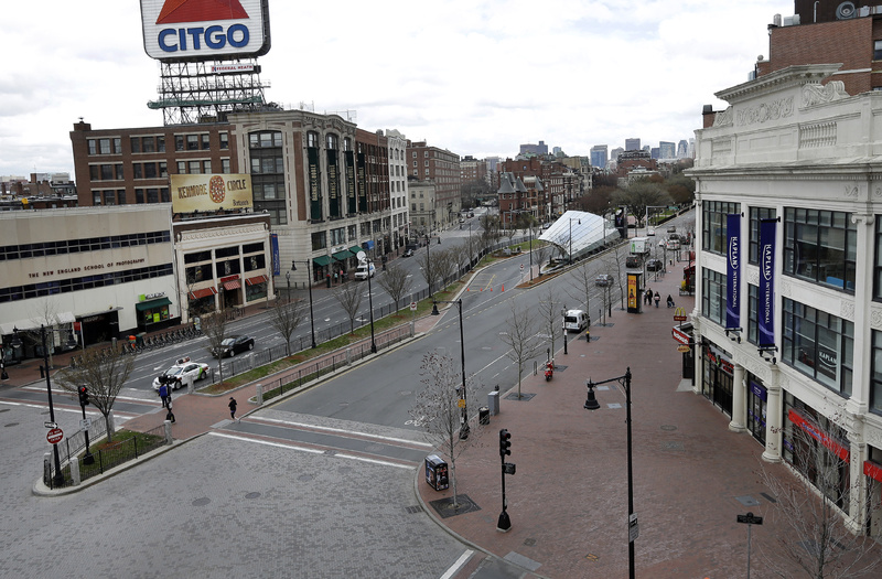 The usually busy Kenmore Square in Boston is virtually deserted at lunchtime Friday after officials advise residents of Greater Boston to stay put.