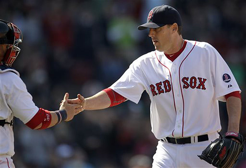 Red Sox pitcher John Lackey, right, is congratulated by catcher Jarrod Saltalamacchia after the last out in the sixth inning against the Houston Astros at Fenway Park in Boston on Sunday. The Red Sox won, 6-1. Fenway Park