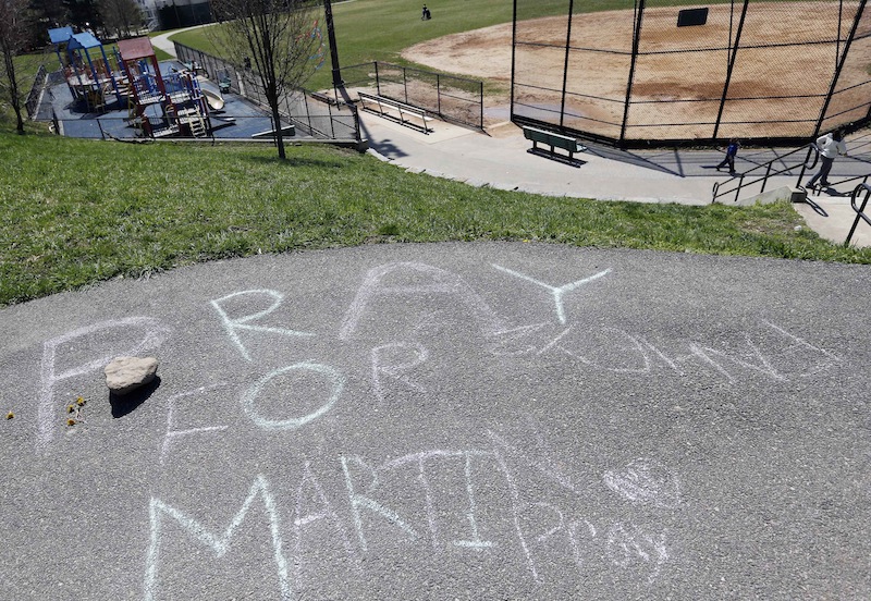 "Pray for Martin" is written in chalk at a park near the home of Martin Richard in the Dorchester neighborhood of Boston,Tuesday, April 16, 2013. 8-year old Martin was killed in the bombing at the finish line of the Boston Marathon on Monday. (AP Photo/Michael Dwyer)