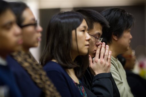 Friends, families and fellow students pack Metcalf Hall in Boston University's George Sherman Student Union on Monday for a memorial service in memory of Boston University graduate student Lu Lingzi, who was killed in the Boston Marathon bombings.