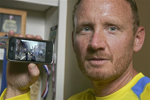 David Green holds up his iPhone with a photo on it he took after the Boston Marathon bombing on Monday, seconds after the bombs exploded, Green pulled out his smartphone and took the photo of the chaos developing a couple hundred yards in front of him -- the smoke, the people running in panic. The Jacksonville businessman then put his phone back in this pocket and went to help the injured. It wasn't until Thursday that Green realized what he had – a picture of suspect Dzhokhar A. Tsarnaev, distinctive in his backward white baseball cap, walking away from the scene.