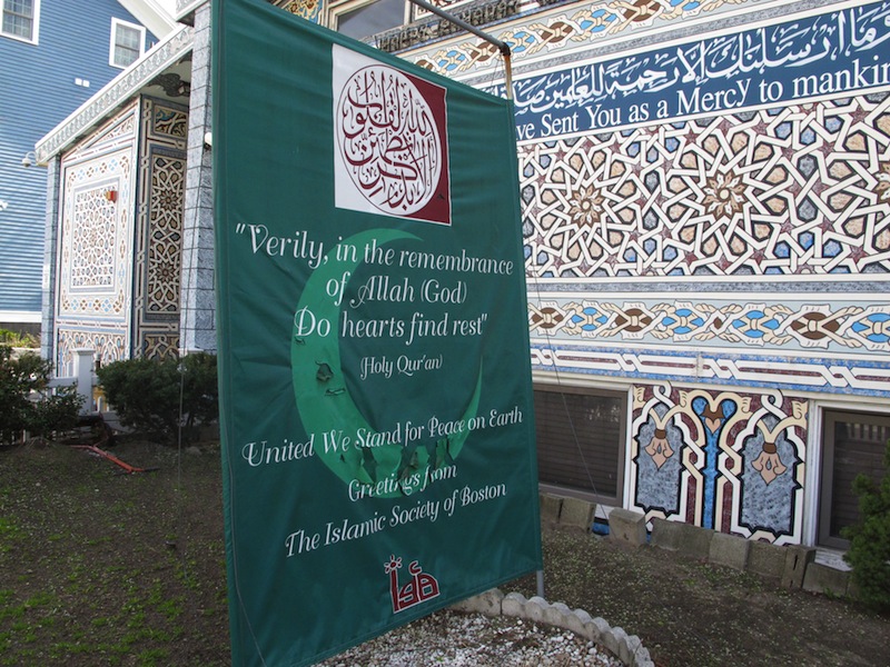 A banner reading "United We Stand For Peace on Earth" stands outside the Islamic Society of Boston mosque in Cambridge, Mass., on Friday, April 19, 2013. A mosque official confirmed that the two suspects in the Boston Marathon bombings, who lived a short distance away, worshipped there occasionally. Tamerlan Tsarnaev ranted at a neighbor about Islam and the United States. His younger brother, Dzhokhar, relished debating people on religion, "then crushing their beliefs with facts." (AP Photo/Allen Breed)