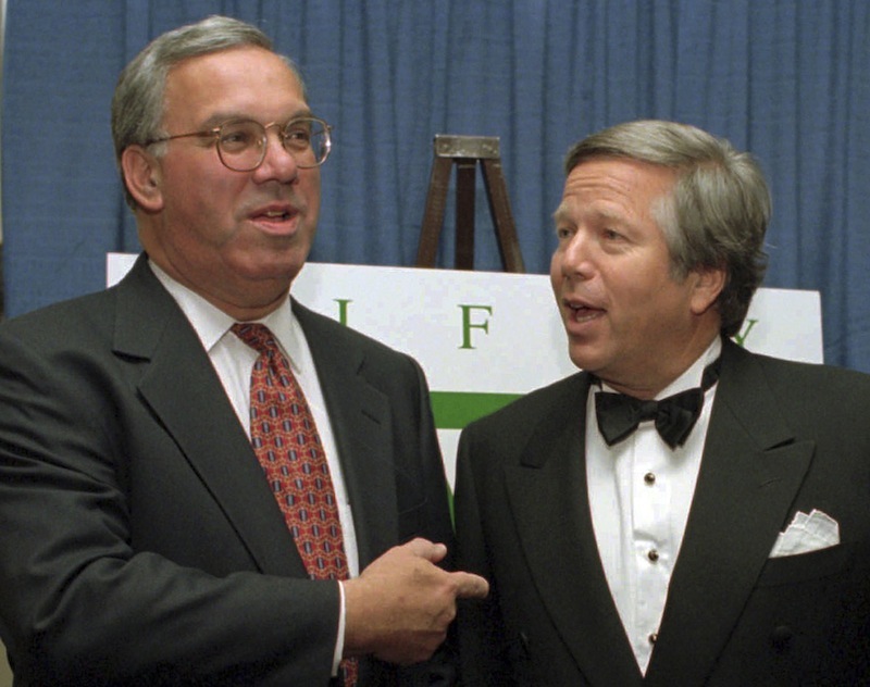 In this Nov. 8, 1995 file photo, Boston Mayor Thomas Menino, left, talks with England Patriots owner Robert Kraft, right, before a benefit dinner in Boston. Boston Mayor Thomas Menino fractured the smaller of the two bones in his lower leg on Friday, the latest in a series of health issues that have dogged the city's longest serving chief executive since the end of last year. (AP Photo/Steven Senne, File)