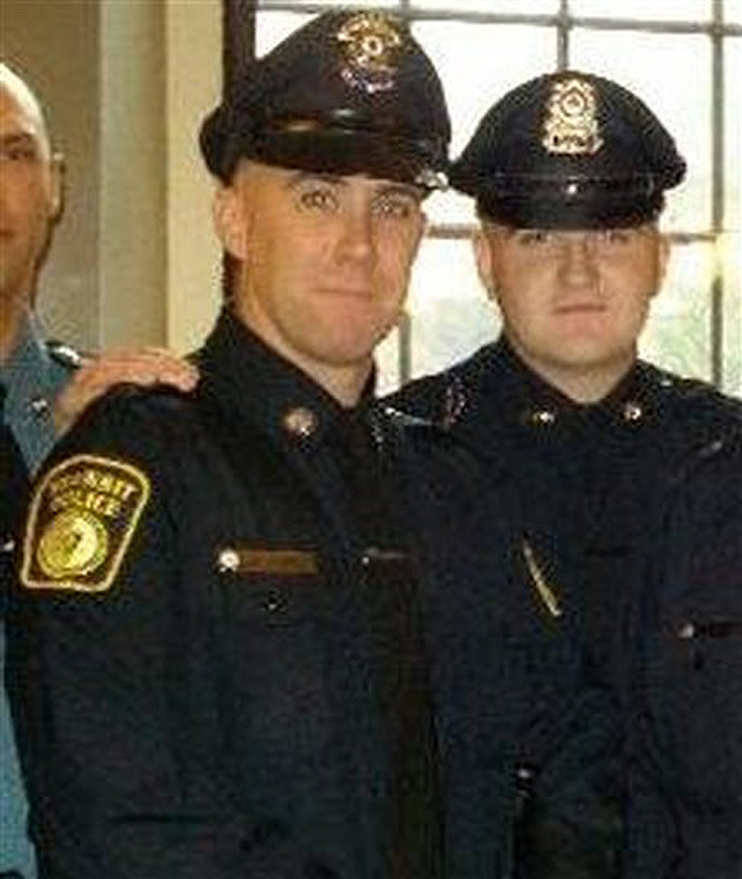 In this 2010 photo provided by the Massachusetts Bay Transportation Authority, Richard Donohue Jr., left, and Sean Collier pose for a photo at their graduation from the Municipal Police Officers' Academy. On Thursday, Massachusetts Institute of Technology Police Officer Collier was fatally shot on the MIT campus, and transit police officer Donohue was shot and critically wounded. Authorities allege that Boston Marathon bombing suspects Tamerlan and Dzhokhar Tsarnaev were responsible.