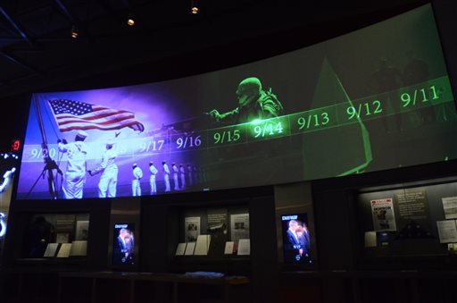 A screen displays images and video of the events and days that followed the 9/11 terrorist attacks as part of an exhibit in the museum area at the George W. Bush Presidential Library and Museum in Dallas.