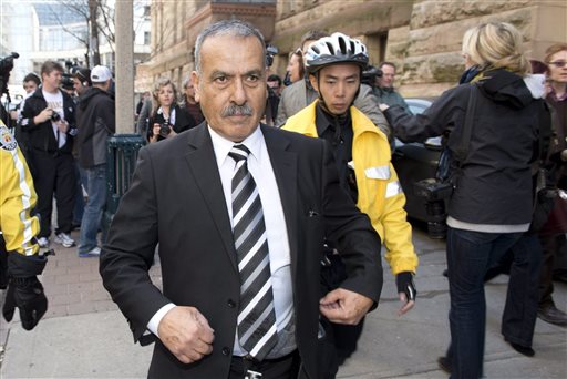 Mohammed Jaser, father of Raed Jaser, leaves court in Toronto on Tuesday. Raed Jaser is accused with another man of plotting to derail a train in Canada with support from al-Qaida elements in Iran.
