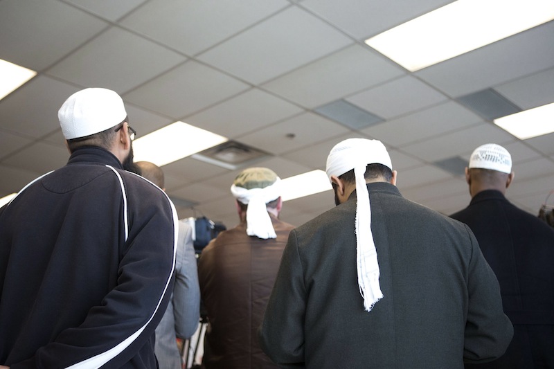 Representatives of Toronto's Islamic community attend a news conference in Toronto as the Royal Canadian Mounted Police announce the arrest of two men accused of plotting a terror attack on rail target, in Toronto, Monday April 22, 2013. (AP Photo/The Canadian Press, Chris Young)