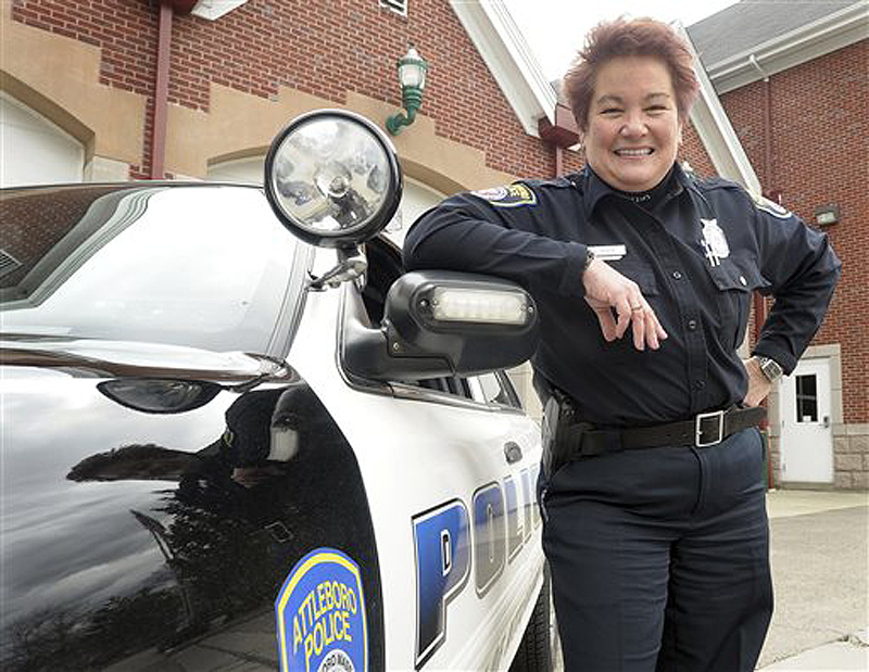 Police Officer Susan Boisse poses for a photo by her squad car in Attleboro, Mass. Boisse is credited with saving her 78-year-old mother’s life by performing cardiopulmonary resuscitation on her in February.