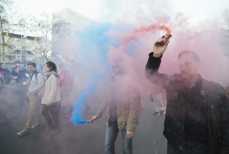 Anti-gay marriage activists hold smoke flares with the color of the logo of the movement during a rally to protest the new law after French lawmakers legalized same-sex marriage, Tuesday, April 23, 2013, in Paris. Lawmakers legalized same-sex marriage after months of debate and street protests that brought many thousands to protest in Paris. Tuesday's 331-225 vote came in the Socialist majority National Assembly and France's justice minister, Christiane Taubira, said the first weddings could be as soon as June. (AP Photo/Michel Euler)