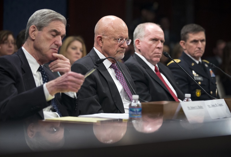 From left, FBI Director Robert Mueller, National Intelligence Director James Clapper; CIA Director John Brennan and Department of Defense's Defense Intelligence Agency Director Lt. Gen. Michael Flynn testify on Capitol Hill in Washington on Thursday before the House Intelligence Committee hearing on worldwide threats.