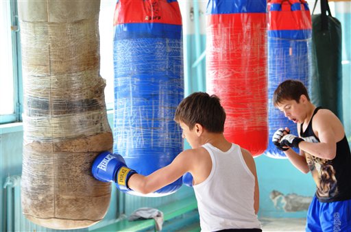 Local boys train at a boxing school in the small Kyrgyz city of Tokmok where bombing suspect Tamerlan Tsarnaev also trained.