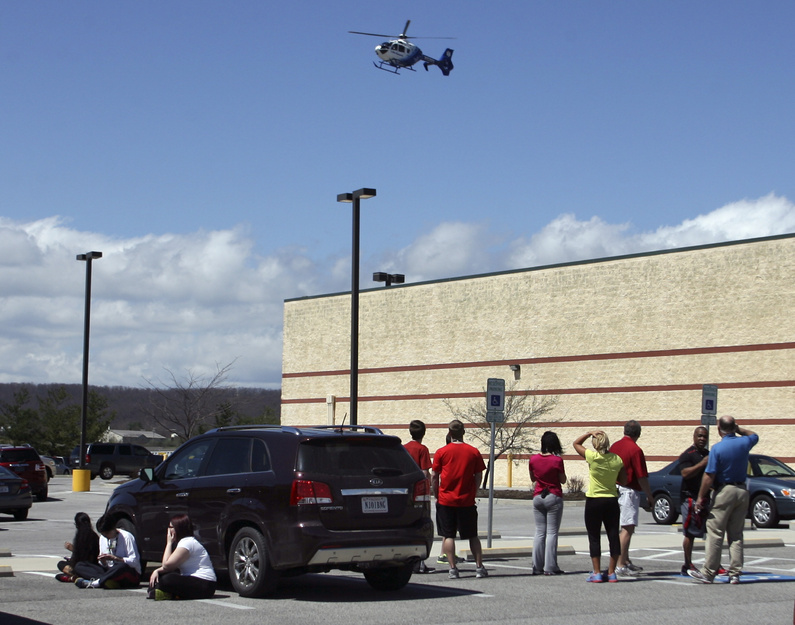 A medical helicopter approaches a parking lot outside the New River Valley Mall in Christiansburg, Va., on Friday after two women were shot there.