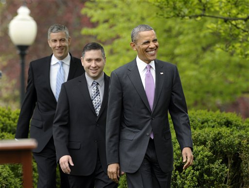 2013 National Teacher of the Year Jeff Charbonneau, center, follows President Barack Obama to the Rose Garden for a ceremony honoring Charbonneau. Education Secretary Arne Duncan at left.