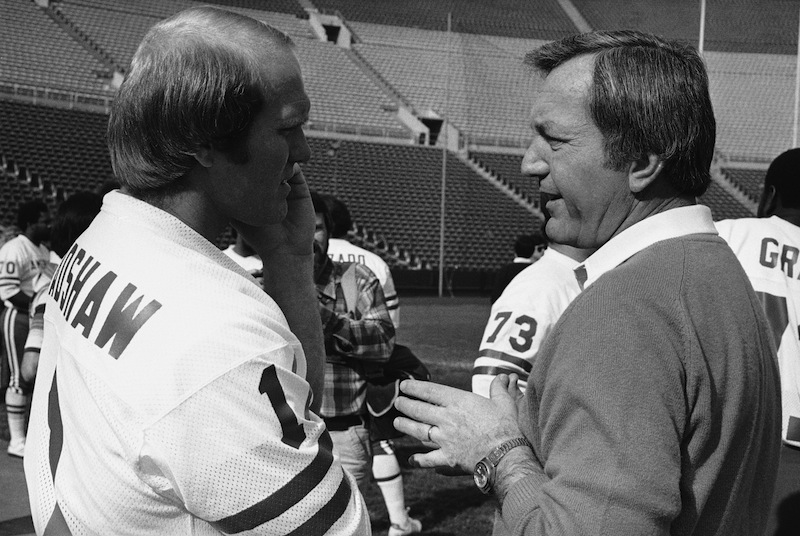 In this Jan. 23, 1979 file photo, Pittsburgh Steelers quarterback Terry Bradshaw, left, talks with New England Patriots coach Chuck Fairbanks prior to the Pro Bowl football game in Los Angeles. Fairbanks, who coached Heisman Trophy winner Steve Owens at Oklahoma and spent six seasons as coach of the New England Patriots, died Tuesday, April 2, 2013, in Scottsdale, Ariz., after battling brain cancer, the University of Oklahoma said in a news release. He was 79. (AP Photo/Wally Fong) football;player;pro;professional;sports