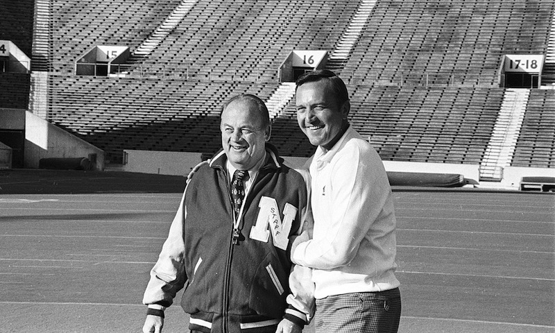 In this Nov. 24, 1971 file photo, Nebraska head coach Bob devaney, left, poses with Oklahoma head coach Chuck Fairbanks in Norman, Okla. Fairbanks, who coached Heisman Trophy winner Steve Owens at Oklahoma and spent six seasons as coach of the New England Patriots, died Tuesday, April 2, 2013, in Scottsdale, Ariz., after battling brain cancer, the University of Oklahoma said in a news release. He was 79. (AP Photo/File)