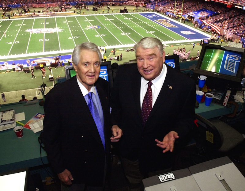 In this Feb. 3, 2002, file photo, Fox broadcasters Pat Summerall, left, and John Madden stand in the booth at Louisiana Superdome before the NFL Super Bowl XXXVI football game in New Orleans. Fox Sports spokesman Dan Bell said Tuesday, April 16, 2013, that Summerall, the NFL player-turned-broadcaster whose deep, resonant voice called games for more than 40 years, has died at the age of 82. (AP Photo/Ric Feld, File) NFL