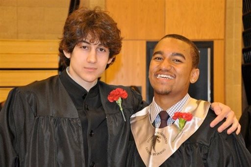 In this undated photo provided by Here & Now radio host Robin Young, Dzhokhar A. Tsarnaev, left, and Young’s nephew, right, pose for a photo after graduating from Cambridge Rindge and Latin High School.