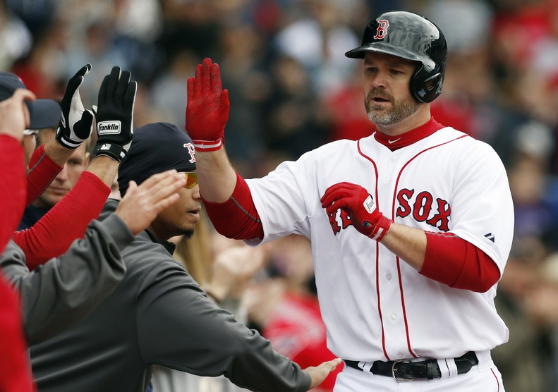 David Ross celebrates his solo home run in the fifth inning against the Tampa Bay Rays in Boston on Saturday.