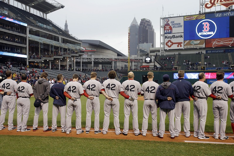 The Boston Red Sox players and coaches observe a moment of silence for the victims of the Boston bombings before a baseball game against the Cleveland Indians Tuesday, April 16, 2013, in Cleveland. (AP Photo/Mark Duncan) Progressive Field
